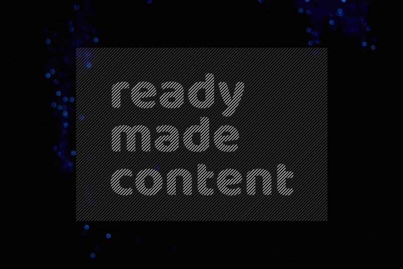 Blue glitter powder isolated on black background