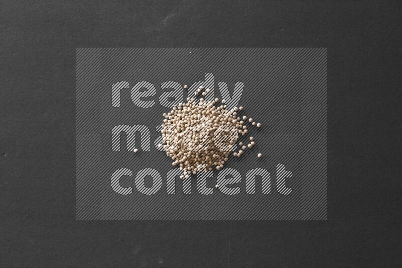 White pepper on a black flooring