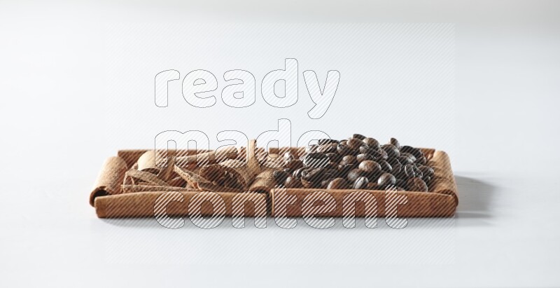 2 squares of cinnamon sticks full of coffee beans and cinnamon on white flooring