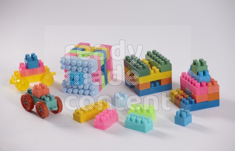 Collection of colorful different kids toys on white background