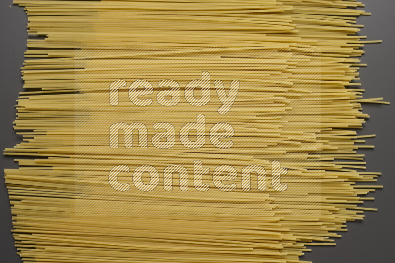 Spaghetti pasta on grey background