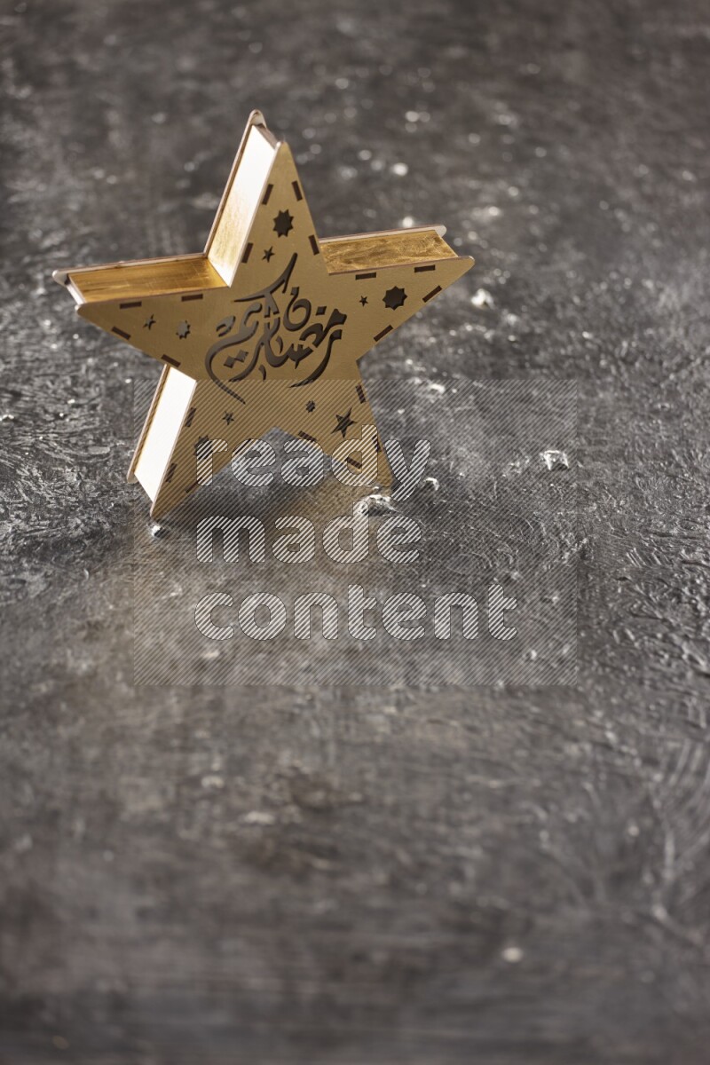 A lantern placed on a textured black background