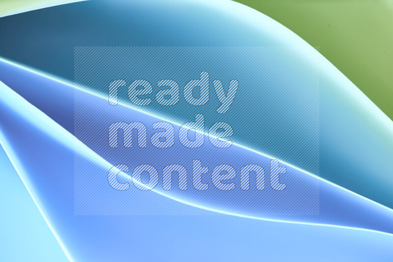 This image showcases an abstract paper art composition with paper curves in green and blue gradients created by colored light