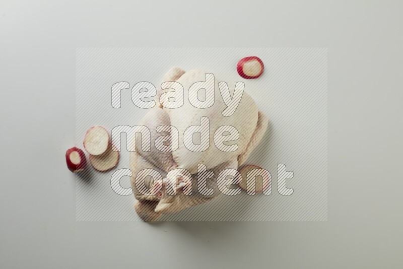 Whole fresh chicken direct on a white background