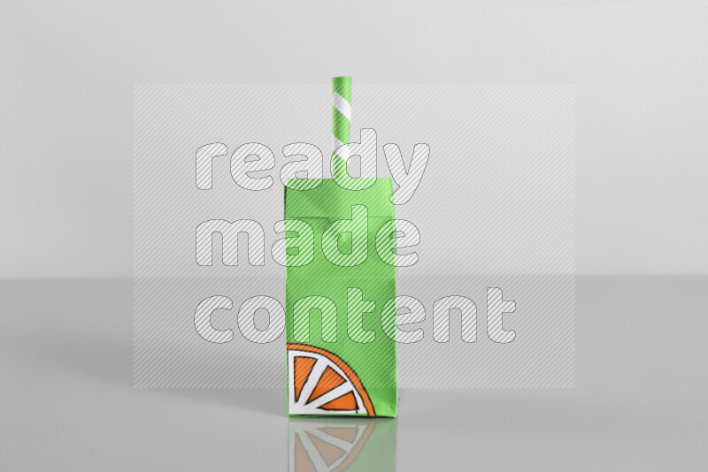 Origami juice box on grey background