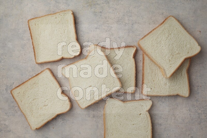 White Toast slices on alight blue textured background