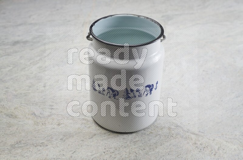 A vintage milk can on grey marble background