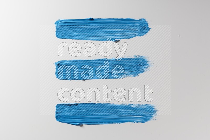 Blue painting brush strokes on white background