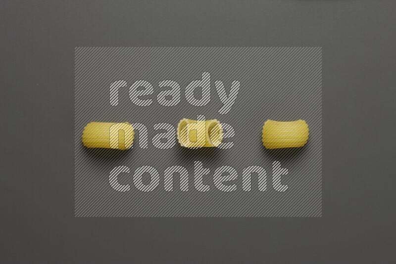 Elbow pasta on grey background