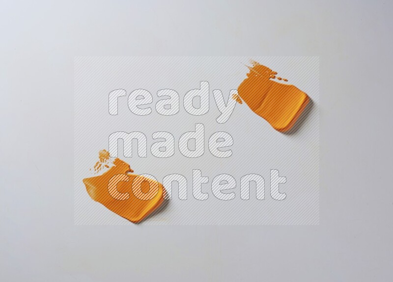 Orange painting knife strokes on white background