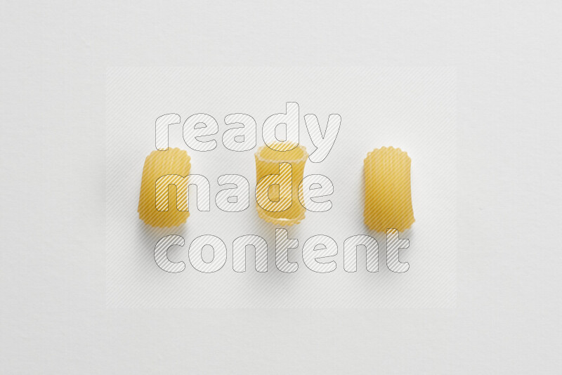 Elbow pasta on white background