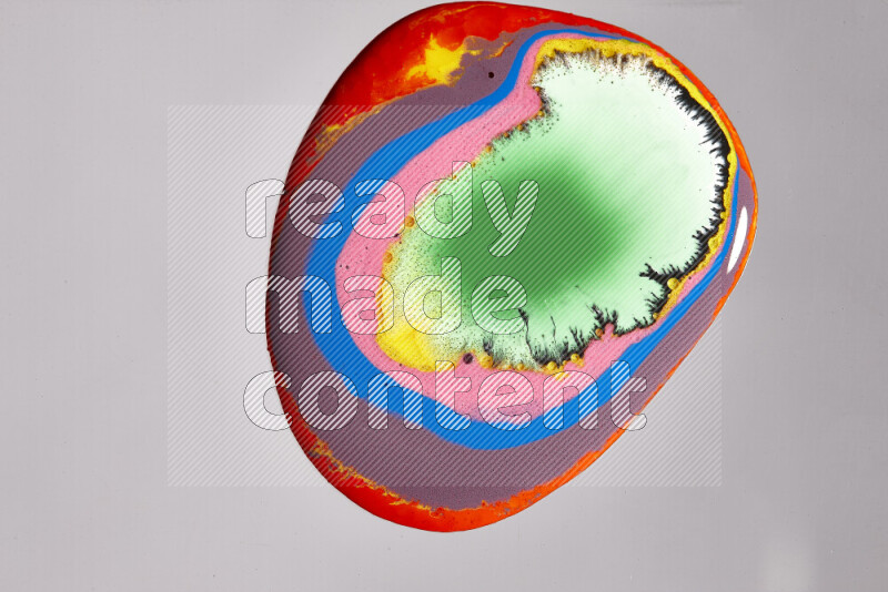 Close-ups of assorted colors blending on a grey background