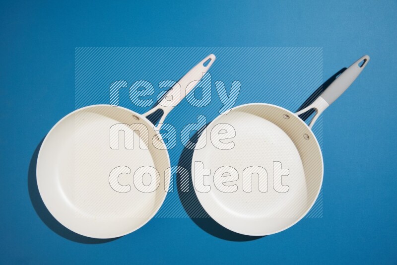 white pan on blue background