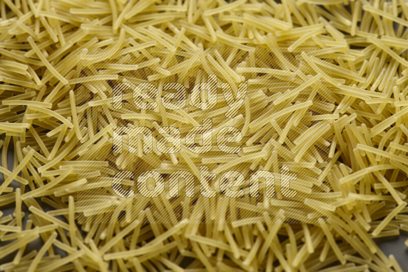 Vermicelli pasta on grey background