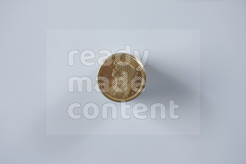 Stack Egyptian 50 piasters coins on grey background