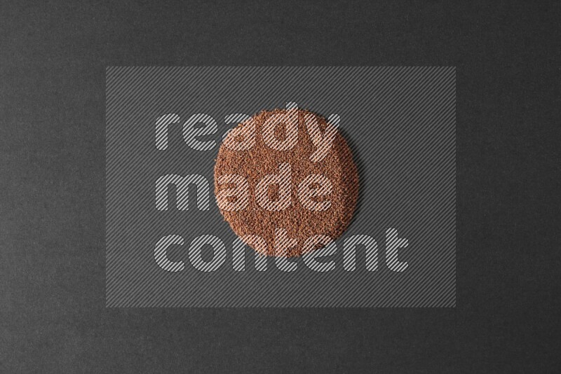 Garden cress seeds in a circle shape on a black flooring