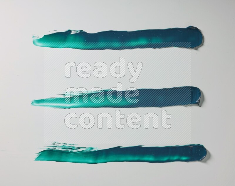 Turquoise painting knife strokes on white background