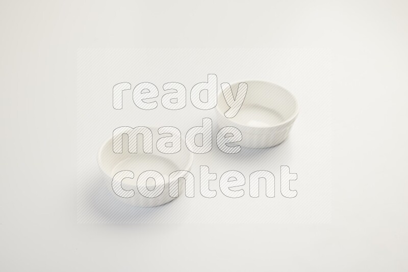 white ceramic round sauce dish on white countertop