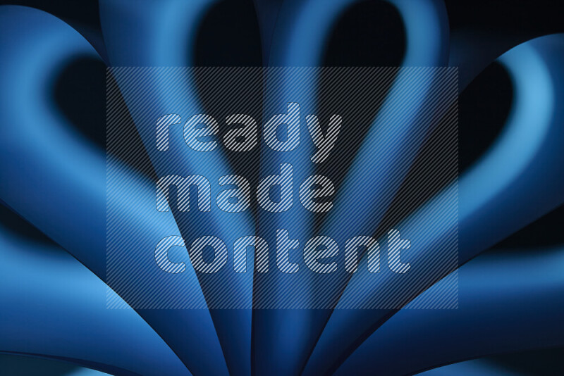 An abstract art piece displaying smooth curves in blue gradients created by colored light