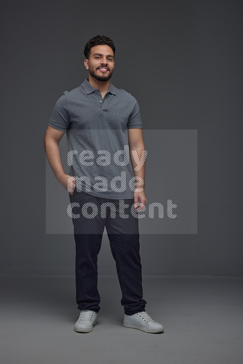 A man wearing casual making multi stand poses  eye level on a gray background