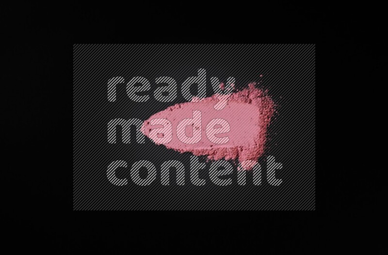 Red powder smears on black background