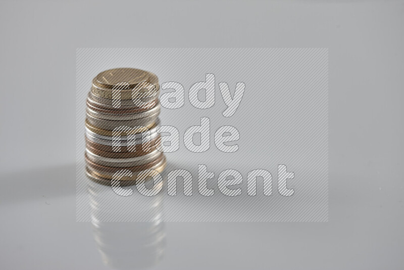 Random old coins on grey background