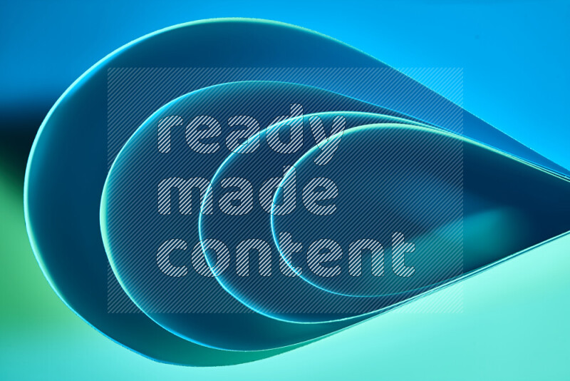 فن تجريدي لورق مطوي على شكل منحنيات ناعمة بتدرجات اللون الأخضر والأزرق