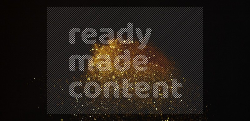 Gold glitter powder isolated on black background
