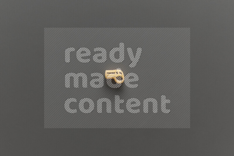 Shaped children pasta on grey background