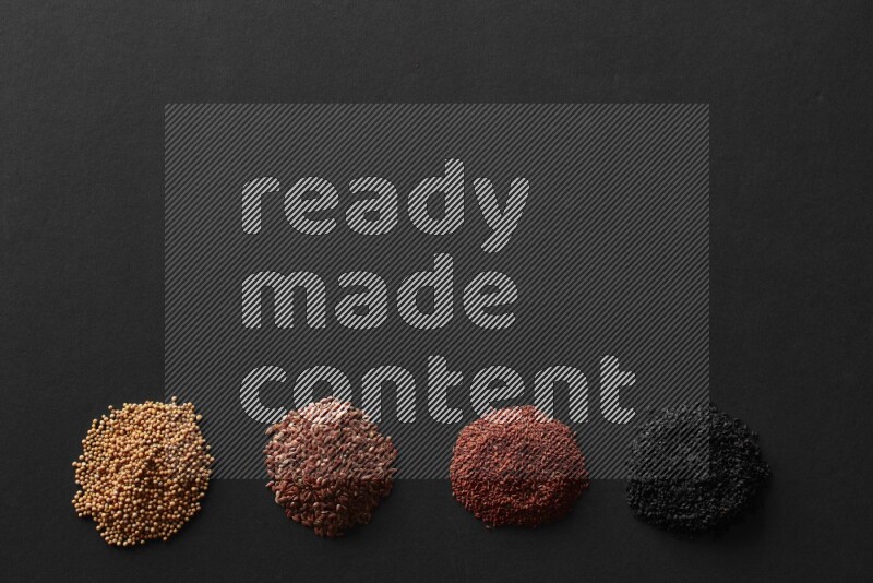 حبة البركة و حبوب الخردل وحبوب الكتان وحب الرشاد علي خلفية سوداء