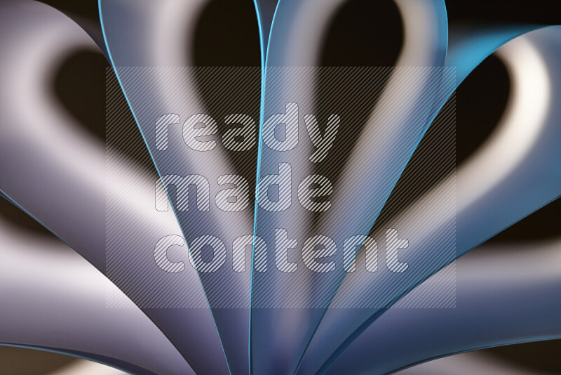 An abstract art piece displaying smooth curves in white and blue gradients created by colored light