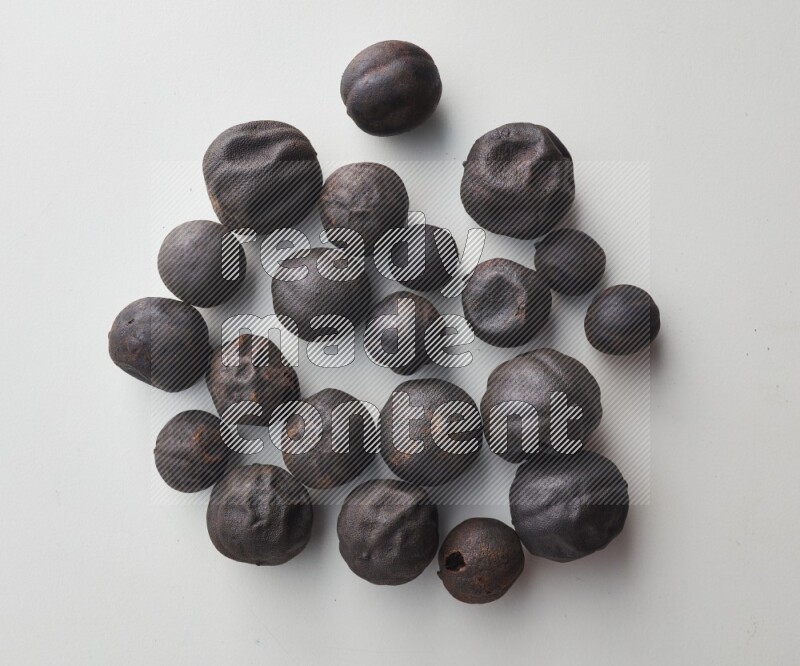 Top-view shot of dried lime (loomi) on white background