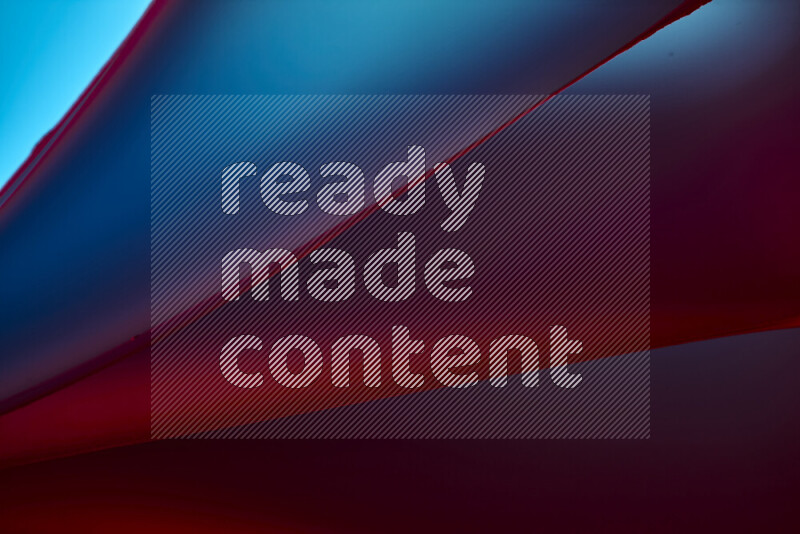 فن تجريدي يعرض منحنيات مع تدرجات الألوان الدافئة والباردة مكونه بضوء ملون