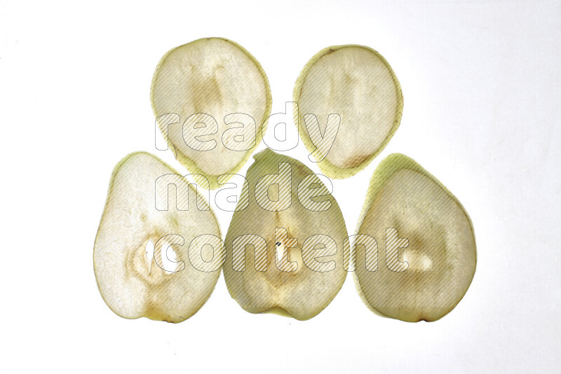 Pear slices on illuminated white background