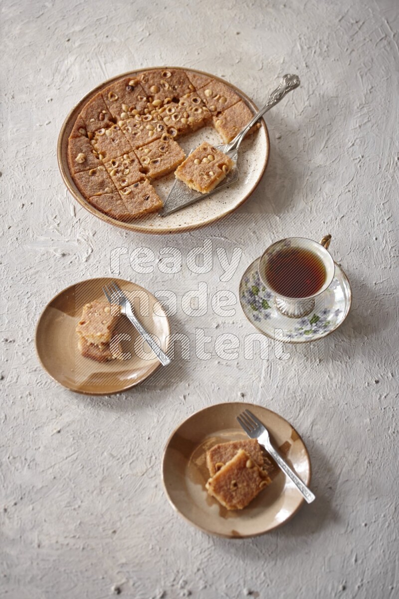 Basbousa with tea in a light setup