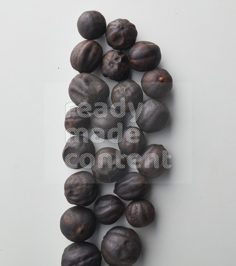 Top-view shot of dried lime (loomi) on white background