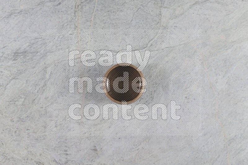 A multicolored pottery Bowl on grey marble background