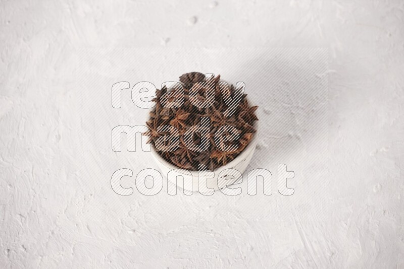 Star Anise in a white bowl on white background