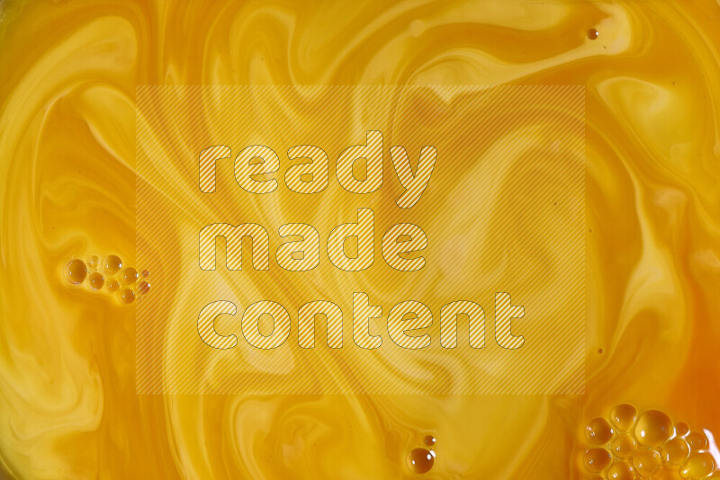 A close-up of abstract different swirling patterns in orange