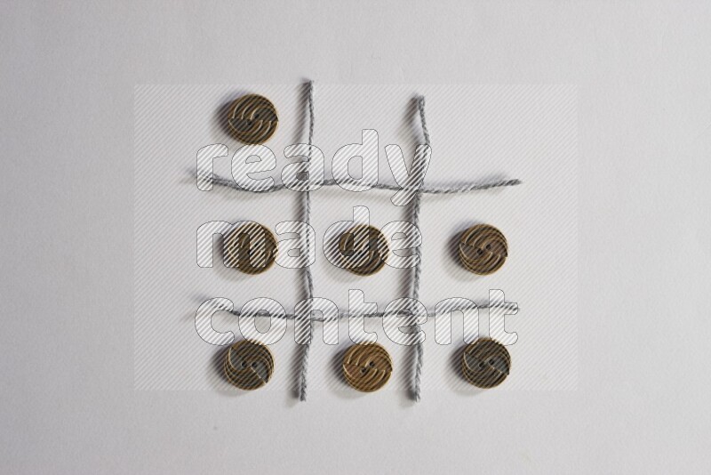 Metal buttons placed on grey background