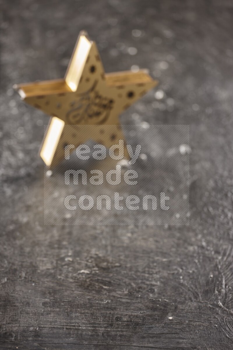 An out of focus lantern on textured black background