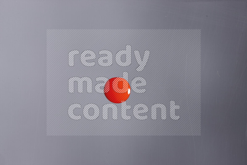 Close-ups of abstract red paint droplets on grey background