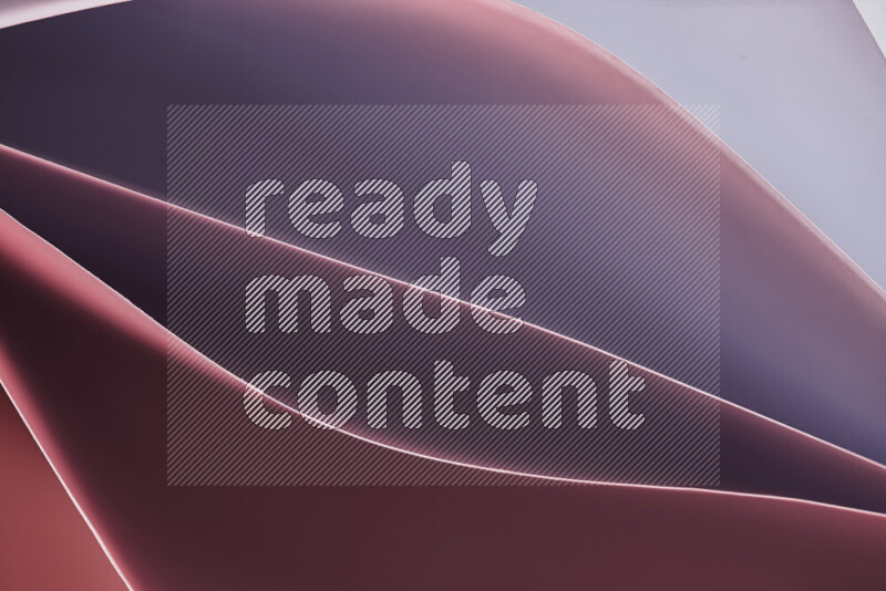 This image showcases an abstract paper art composition with paper curves in different warm gradients created by colored light