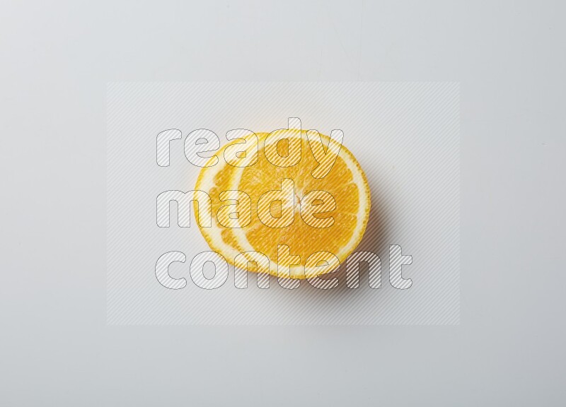Two orange slices on white background
