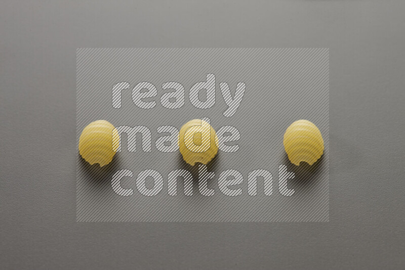 Shells pasta on grey background