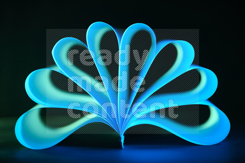 An abstract art piece displaying smooth curves in blue gradients created by colored light