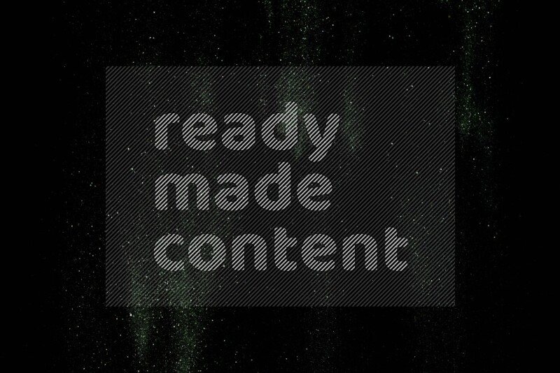 Green glitter powder isolated on black background