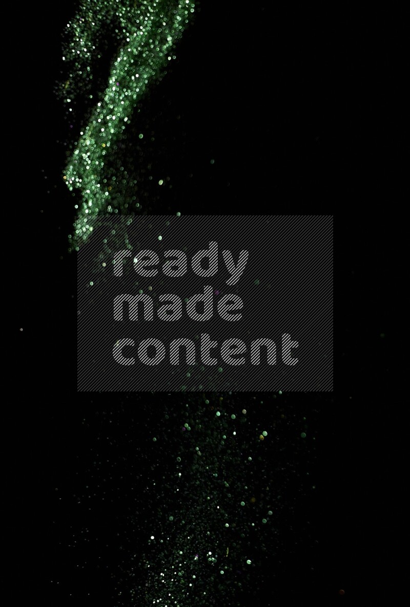 Green glitter powder isolated on black background