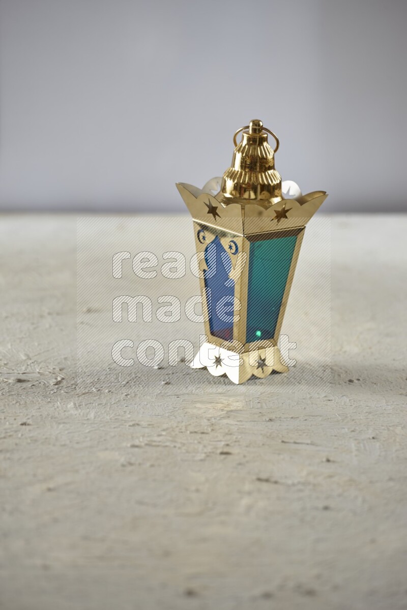 A lantern placed on a textured white background