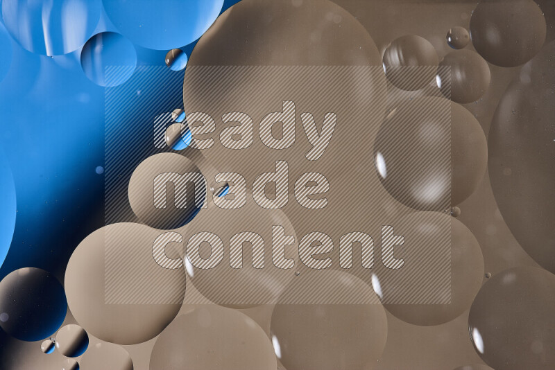Close-ups of abstract oil bubbles on water surface in shades of blue and brown